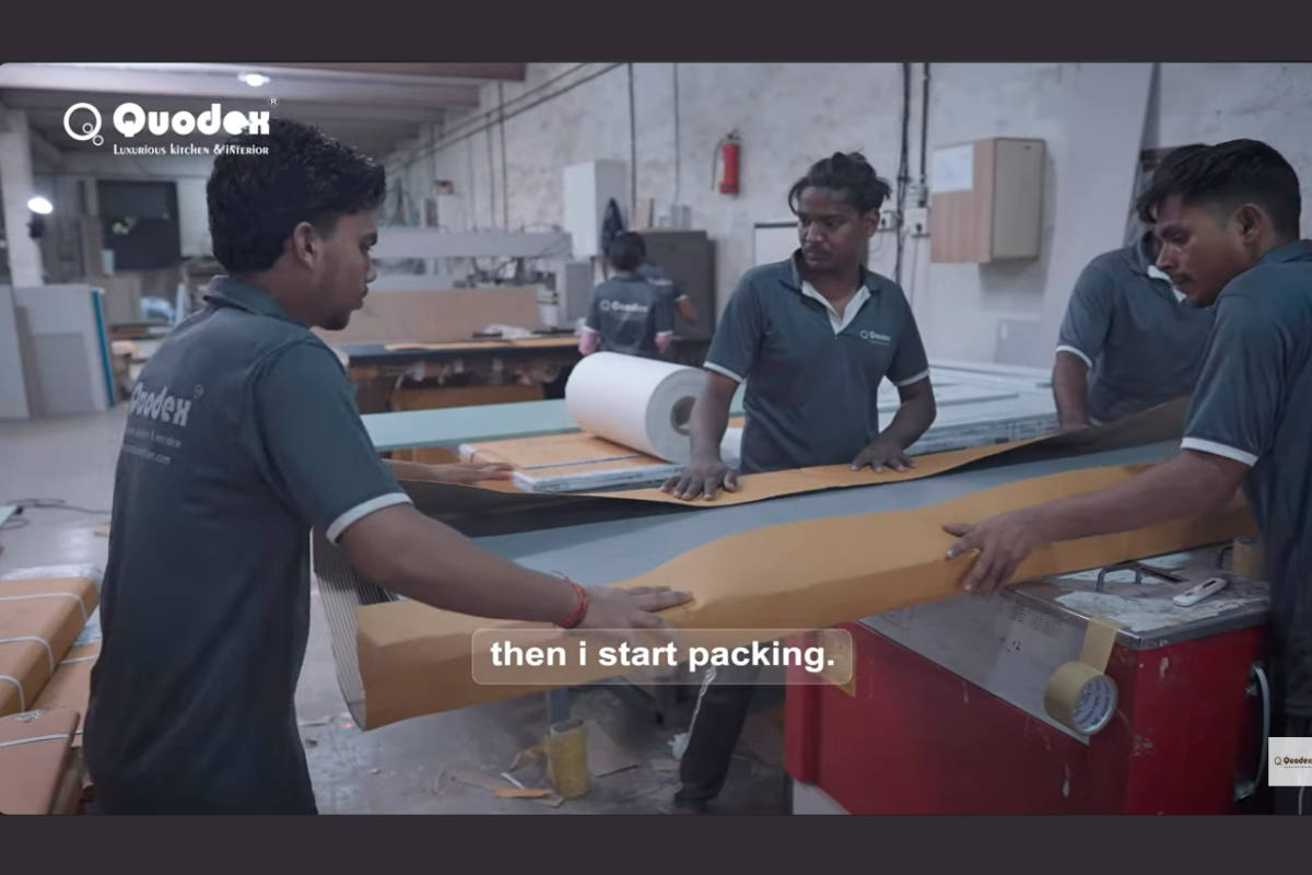 Quodex factory team preparing and finishing panels for modular kitchen manufacturing