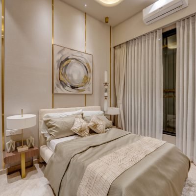 Luxury beige bedroom interior with gold wall accents, upholstered bed, bedside tables, and sheer curtains.